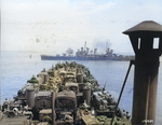 USS Boise firing on armor forces near Gela, Sicily, Italy as LST-325, full of US Army trucks, approached the landing beaches, 11 Jul 1943