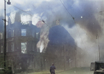 Burning residential building at the intersection of Zamenhofa and Wolynska Streets in Warsaw, Poland, Apr-May 1943