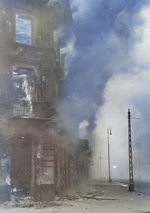 Burning residential building at the intersection of Zamenhofa and Wolynska Streets in Warsaw, Poland, Apr-May 1943