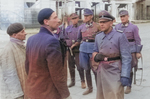 German officer (possibly SS General Maximilian von Herff) questioning Jews in Warsaw, Poland, 14-15 May 1943; note Jürgen Stroop (with goggles) and Karl Kaleske (or Erich Steidtmann; first from right) in background