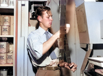 Photographer Ed Westcott working in his lab at Clinton Engineer Works, Oak Ridge, Tennessee, United States, 1945