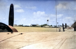 View of Sand Island, Midway Atoll from a PB2Y-5 Coronado aircraft in the submarine basin, circa early 1944