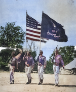 Soldiers of US Army 1st Filipino Infantry Regiment bearing flags on the parade ground, date unknown