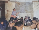 Major Louis E. Scherck briefing airmen of 40th Bomb Group, USAAF XX Bomber Command at a base in China, 14 Oct 1944; note map of Taiwan showing Takao region