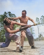 African-American US Marine Corps Corporal Arvin Lou Ghazlo giving judo instructions to Private Ernest C. Jones, Montford Point Camp, North Carolina, United States, Apr 1943; note M1 Garand rifle