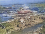 Kagi butanol plant under attack by B-25 bombers of 3rd Bombardment Group, USAAF 5th Air Force, Kagi (now Chiayi), Taiwan, 3 Apr 1945, photo 2 of 5