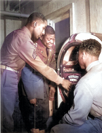 African-American US Army soldiers listening to music on a jukebox, date unknown