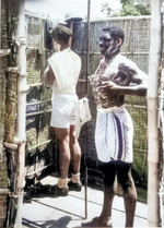 African-American US Army Sergeants William H. Whaley and Delos Oliver cleaning at the end of a day, Jul 1943