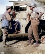 War Correspondent Ted Stanford of The Pittsburgh Courier interviewing African-American US Army Sergeant Morris O. Harris of the 784th Tank Battalion of the 9th Army, 28 Mar 1945