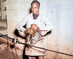 US Navy African-American Seaman 1st Class E. Perry splacing steel cable, 17 May 1945