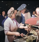 Eleanor Roosevelt talking with woman machinist during her goodwill tour of the United Kingdom, Nov 1942