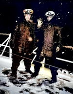 Two African-American US Coast Guard officers, Ensign J. J. Jenkins and Lt (jg) Clarence Samuels, aboard a USCG cutter in the North Atlantic, date unknown; note the wintry conditions on deck