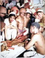 African-American US Coast Guardsmen studying the assembly of a 20-mm AA gun aboard a ship, date unknown