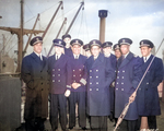 African-American crew of Liberty Ship SS Booker T. Washington after her maiden voyage, England, 8 Feb 1943; L to R: Lastic, Young, Hlubk, Blackman, Smith, Mulzac, Fokes, Kruley, Rutland, Larson