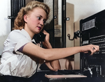 Seaman 2nd Class Mary Garrell operating the switchboard at WAVES Quarters 