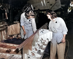 WAVES Aviation Metalsmith 3rd Class Claire Bickham and Seaman 1st Class (Aviation Metalsmith) Susie Alvis riveting aircraft, Naval Air Station, Jacksonville, Florida, United States, 24 Jul 1943