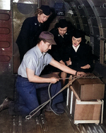 Aviation Metalsmith J. J. Lombardo showing WAVES personnel how to tie down cargo, Naval Air Transport Service School, Naval Air Station, Oakland, California, United States, 17 Feb 1945