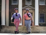 Admiral Arleigh Burke and Vice Admiral Austin Doyle in front of the Headquarters of the Chief of Naval Air Training, Naval Air Station Glenview, Illinois, United States, 16 Sep 1955