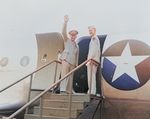 General Dwight Eisenhower waving to a crowd while boarding an aircraft, Washington National Airport, Arlington, Virginia, United States, 18 Jun 1945; note his son John Eisenhower