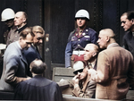 Heß, Seyß-Inquart, Frank, Papen, Frick, and Speer talking to each other, Nuremberg, Germany, 1945-1946; note Alfred Jodl and policeman Albert Rose in background