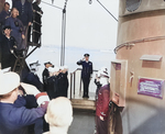 King George VI returning the salute of American servicemen aboard USS Augusta, Plymouth, England, United Kingdom, 2 Aug 1945; the monarch was visiting President Harry Truman aboard this ship