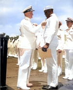 Doris Miller receiving the Navy Cross award from Admiral Chester Nimitz, onboard carrier Enterprise, Pearl Harbor, US Territory of Hawaii, 27 May 1942; photo 2 of 2