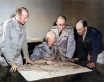 Major General Richard Sutherland, Admiral Chester Nimitz, Vice Admiral Robert Ghormley, and Major General Millard Harmon meeting aboard USS Argonne at Nouméa, New Caledonia, 28 Sep 1942