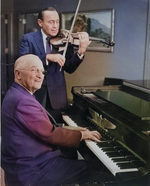 Harry Truman (piano) and Jack Benny (violin) playing music together, 3 Sep 1959