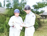 Lieutenant General Walton Walker and Major General William Dean studying a map near Taejon, Korea, 8 Jul 1950