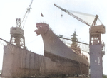 USS Wisconsin in floating drydock ABSD-1 in Apra Harbor, Guam, 5 Apr 1952.