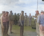 Captain George C. Montgomery awarding a citation ribbon to Aviation Ordnanceman 2nd Class Harvey J. Rowe aboard USS Anzio, 6 Jan 1945, photo 2 of 2