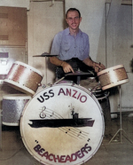 AMM 3rd Class L. H. McDowell at the drums during an orchestra performance aboard USS Anzio, 18 Feb 1945