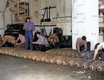 Men fusing bombs aboard USS Anzio, 20 Apr 1945