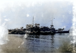 Broadside view of Biscayne in her original configuration with a large crane and clear fantail, Boston Navy Yard, Massachusetts, United States, 19 Jan 1942; note OS2U Kingfisher aircraft on tail