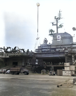 USS Essex docked at Yokosuka, Japan, 29 Sep 1951; note CCKW truck on pier and AFKWX truck on crane