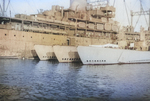 Submarine tender USS Griffin with unidentified submarines (possibly USS Carp, USS Kingfish, USS Paddle, USS Hoe, USS Pogy, or USS Jack), Midway Atoll, 26 Aug-1 Sep 1945.