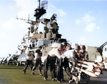 Crewmen of USS Hancock preparing FFAR rockets for an aircraft strike against Japanese positions on Taiwan island, 12 Oct 1944. The Hancock air group fired 176 rockets on this date.