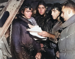 Rescued survivors of USS Helena aboard destroyer USS Nicholas, Solomon Islands, 6 Jul 1943. Photo 1 of 2.