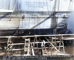 USS Helena in drydock at Pearl Harbor Navy Yard, US Territory of Hawaii, 13 Dec 1941, photo 1 of 2; note torpedo damage between frames 69 1/2 and 80 1/2 on starboard side