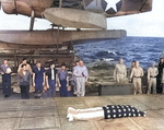 Funeral service on the fantail of the USS Honolulu on 7 Jul 1943 for F1c Irvin Edwards, a USS Helena crewman who died of his wounds. RAdm Walden Ainsworth stands with other Helena crewmen. Photo 2 of 2.