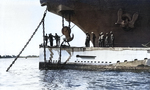 USS Holland preparing to hoist USS S-4 by the bow in preparation for repair work, 1920s