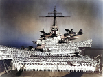 Officers and crew of battleship Idaho posed on the after deck and after 14-in gun turrets, circa 1938; note SOC-3 Seagull floatplanes of Observation Squadron Three atop Turret #3 catapult and on deck