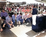 The Catholic chaplain aboard battleship Indiana serving communion on the ship