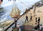 Battleship Indiana receiving powder for her 16-in guns via highline from AE-12 Wrangell, off Okinawa, Japan, 8 Apr 1945