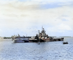 Battleship Indiana at Majuro, Marshall Islands for repairs after collison with battleship Washington, 3 Feb 1944; note Washington and AR-4 Vestal in background