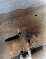 Kaiyo (center) under attack by SB2C Helldiver bombers from USS Essex, Kure, Japan, 19 Mar 1945; the carrier at bottom was either Amagi or Katsuragi