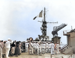 Raising of the French flag aboard the ex-USS Langley upon being commissioned as the La Fayette in the French Navy, Philadelphia Naval Shipyard, Pennsylvania, United States, 2 Jun 1951