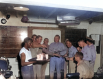 Lieutenant Commander Edward C. Outlaw and pilots of his VF-32 squadron celebrating after completing a mission over Truk, Caroline Islands, 29 Apr 1944