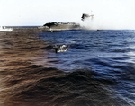 A whaleboat evacuating men from USS Lexington, 8 May 1942, photo 1 of 2