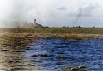 USS Lexington burning as she was being abandoned, 8 May 1942, photo 2 of 2; note USS Chester and other warships nearby